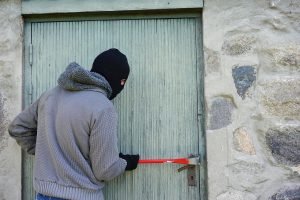 burglar breaking into house or rental property